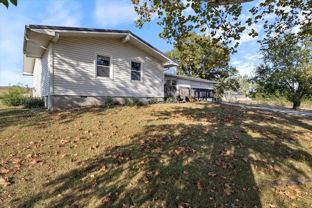 view of property exterior with a lawn