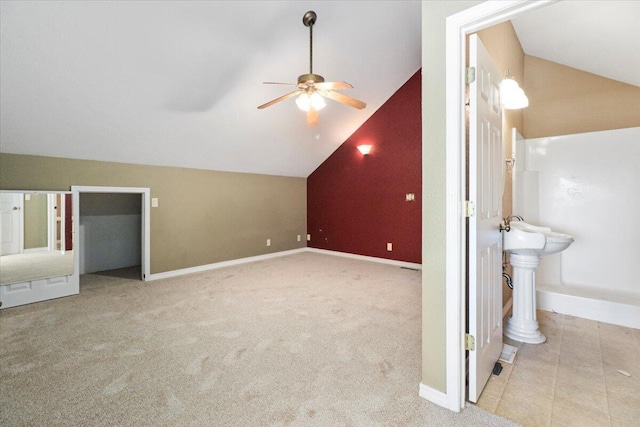 bonus room featuring lofted ceiling, ceiling fan, and light carpet