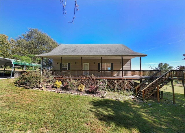 exterior space with a front yard, a shingled roof, a carport, and stairs