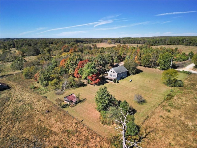 aerial view featuring a forest view and a rural view