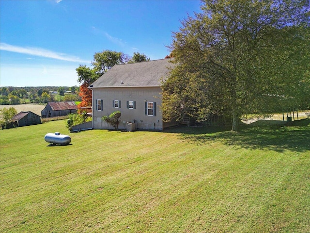 view of yard featuring central AC unit