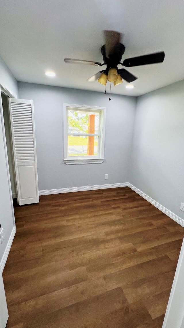 empty room with wood finished floors, baseboards, recessed lighting, and ceiling fan