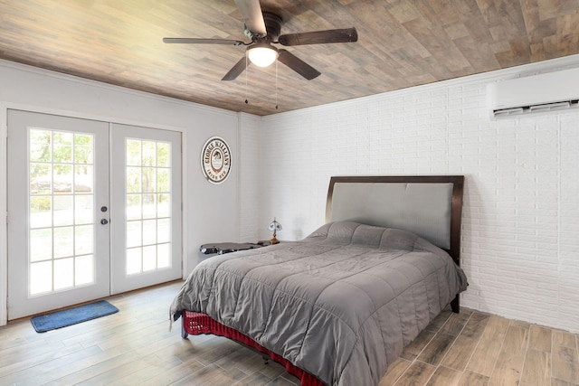 bedroom featuring french doors, access to outside, hardwood / wood-style flooring, and ceiling fan