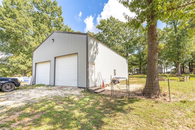 garage featuring a yard