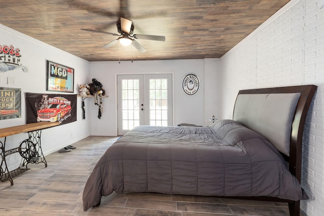 bedroom featuring french doors, brick wall, access to outside, ceiling fan, and hardwood / wood-style floors