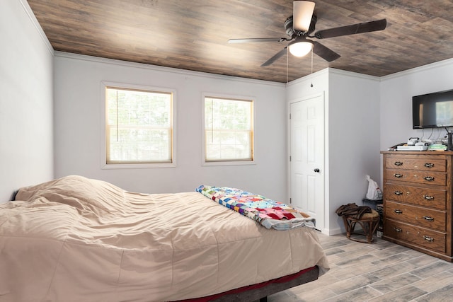 bedroom featuring ceiling fan, wood ceiling, ornamental molding, and light hardwood / wood-style flooring