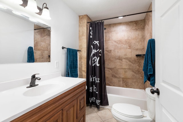 full bathroom with vanity, tile patterned floors, shower / bath combination with curtain, toilet, and a textured ceiling