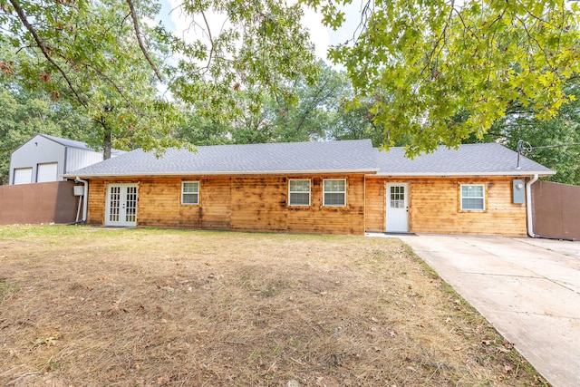 single story home featuring french doors