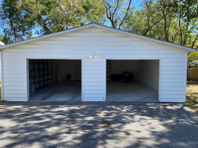 garage featuring wooden walls