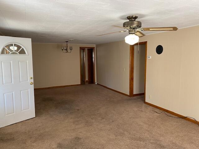 unfurnished room featuring ceiling fan and light carpet