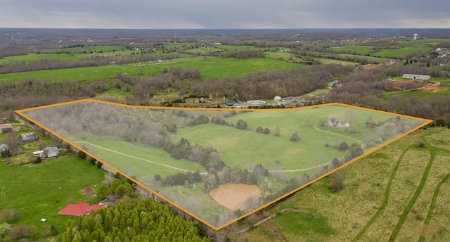 birds eye view of property with a rural view