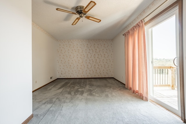 interior space with ceiling fan, a textured ceiling, and a healthy amount of sunlight