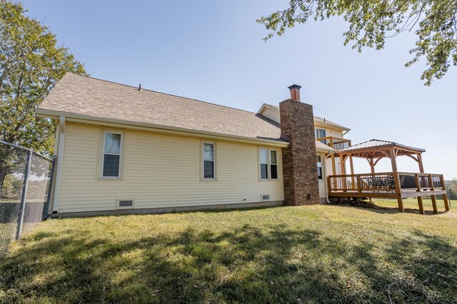 945 Ozark Rd, Nixa, MO 65714 - back of house with a gazebo, a yard, a chimney, and fence