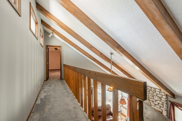 945 Ozark Rd, Nixa, MO 65714 - hall with vaulted ceiling with beams, carpet, and a textured ceiling