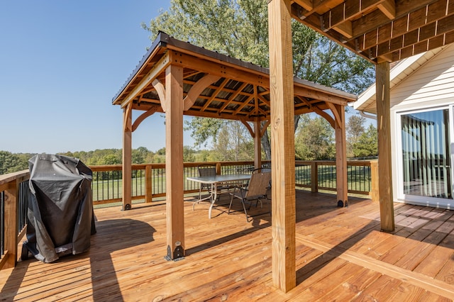 wooden terrace featuring a gazebo