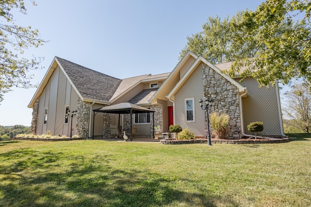 back of house featuring a gazebo, a patio area, and a lawn