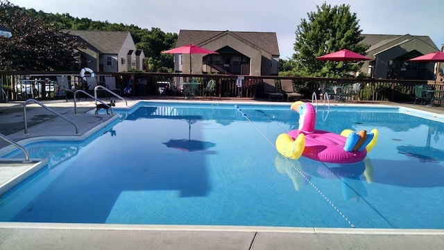 view of pool featuring a patio area