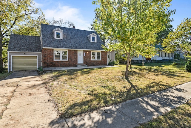 cape cod-style house with a garage and a front lawn