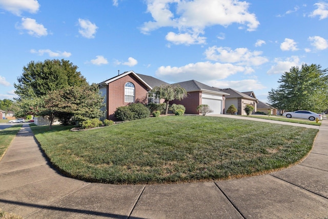 ranch-style house with a front yard and a garage