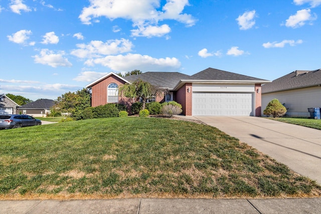 ranch-style home with a garage and a front yard