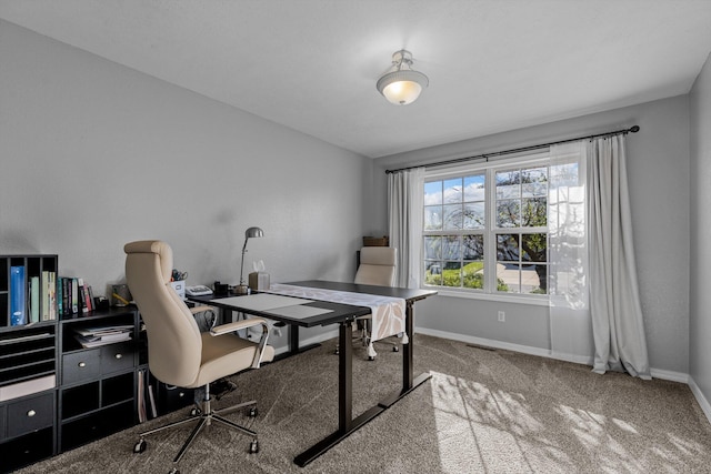 office area featuring light carpet