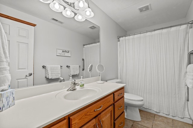 bathroom featuring tile patterned flooring, a shower with shower curtain, vanity, and toilet