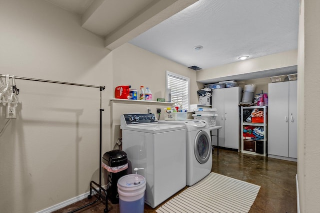 washroom with washing machine and dryer