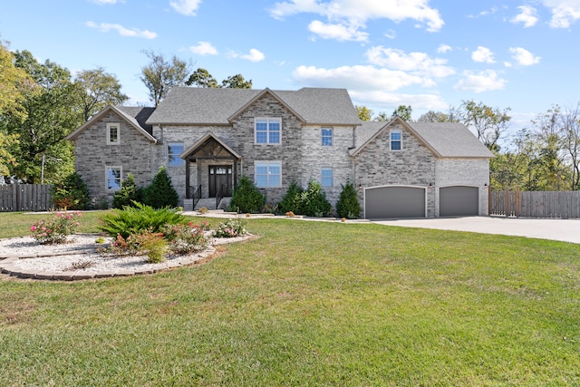 view of front of home featuring a front lawn and a garage