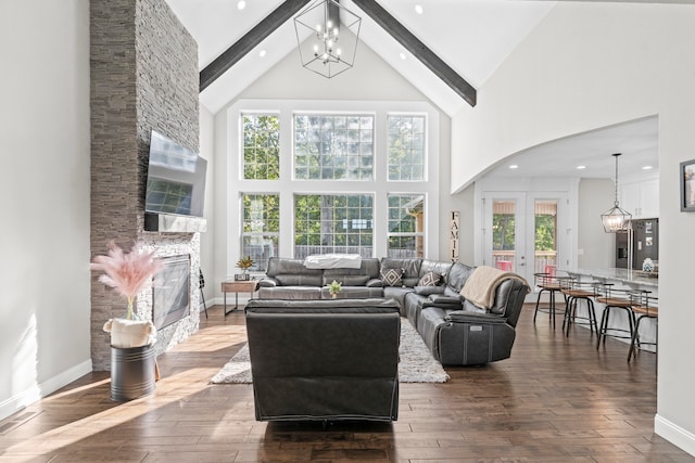 living room featuring a fireplace, wood-type flooring, high vaulted ceiling, and beam ceiling