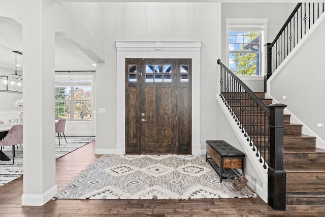 foyer with a healthy amount of sunlight and hardwood / wood-style floors