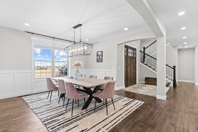 dining room with dark hardwood / wood-style flooring