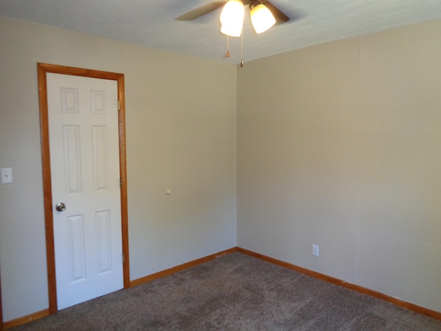 spare room with ceiling fan and carpet flooring