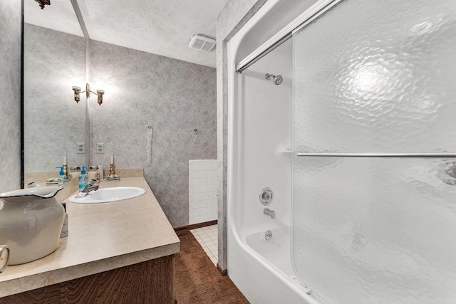 1400 W Oak St, Ozark, MO 65721 - full bath featuring a textured ceiling, vanity,  shower combination, baseboards, and visible vents