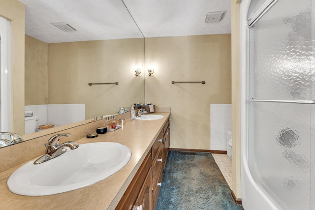 1400 W Oak St, Ozark, MO 65721 - bathroom with double vanity, a shower with shower door, and a sink