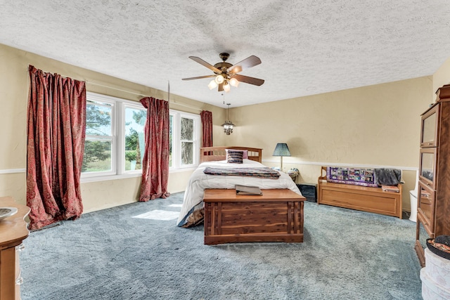 1400 W Oak St, Ozark, MO 65721 - carpeted bedroom with ceiling fan and a textured ceiling