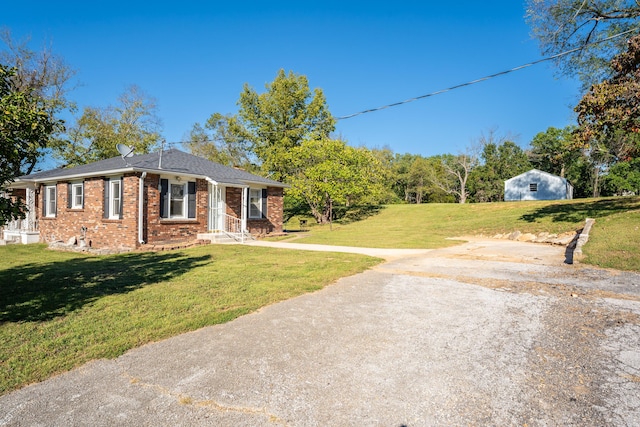 1400 W Oak St, Ozark, MO 65721 - view of front facade with brick siding and a front yard