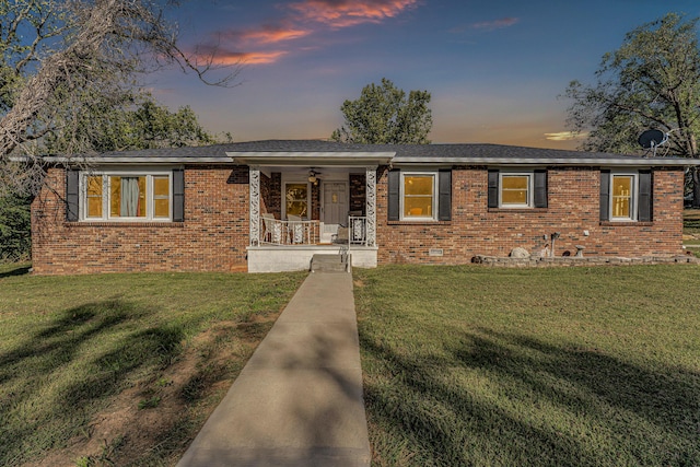 1400 W Oak St, Ozark, MO 65721 - ranch-style home featuring a porch, brick siding, and a yard