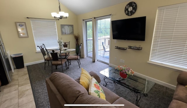 420 Fall Creek Dr Unit 6, Branson, MO 65616 - living room with light tile patterned floors, lofted ceiling, baseboards, and an inviting chandelier