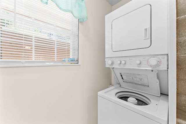34 Golfshores Dr Unit 8, Branson, MO 65616 - clothes washing area with stacked washer and dryer, laundry area, and a healthy amount of sunlight