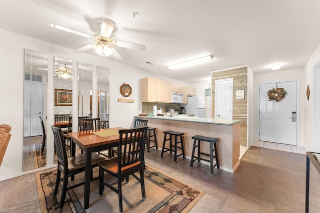 34 Golfshores Dr Unit 8, Branson, MO 65616 - dining room featuring ceiling fan, baseboards, and visible vents