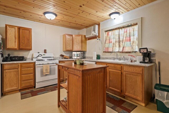 kitchen featuring a sink, stainless steel microwave, white gas stove, a wall mounted air conditioner, and wooden ceiling