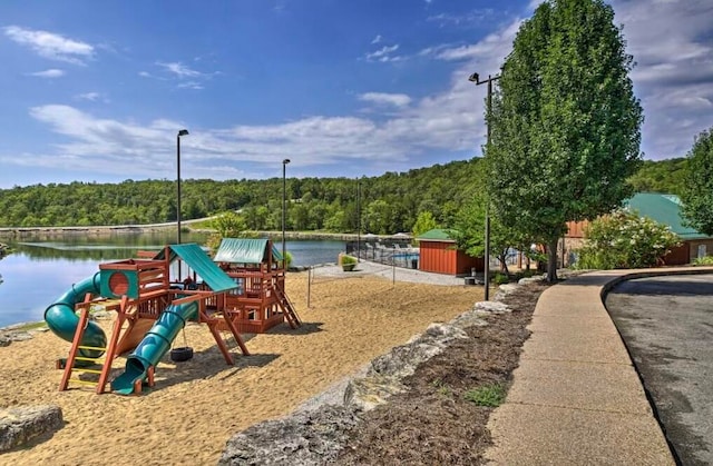 view of play area with a water view