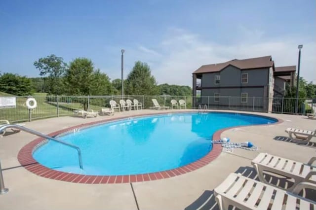 view of pool featuring a patio area