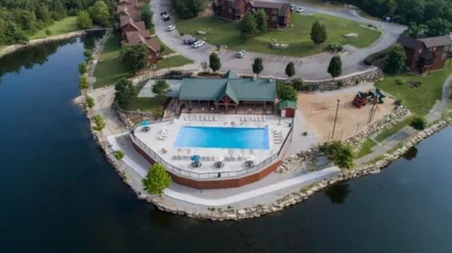 birds eye view of property featuring a water view