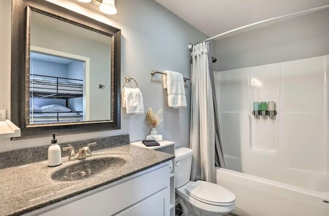 full bathroom with shower / tub combo, vanity, and toilet