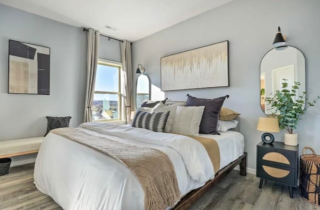 bedroom featuring dark hardwood / wood-style flooring