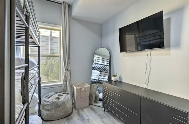 interior space featuring light hardwood / wood-style floors, a wealth of natural light, and a textured ceiling