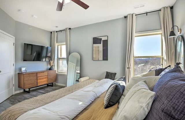 bedroom featuring dark hardwood / wood-style floors and ceiling fan