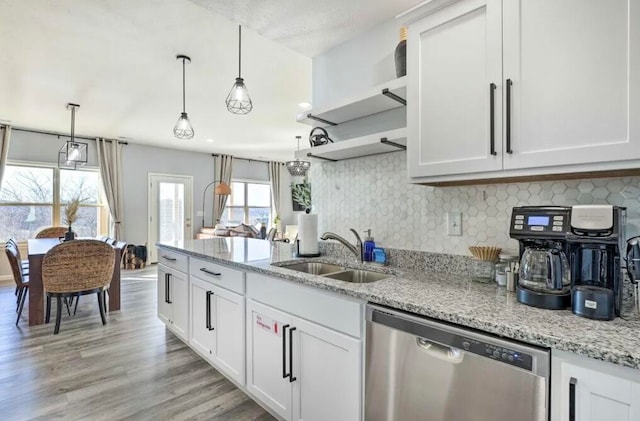 kitchen featuring dishwasher, light hardwood / wood-style flooring, sink, and white cabinetry