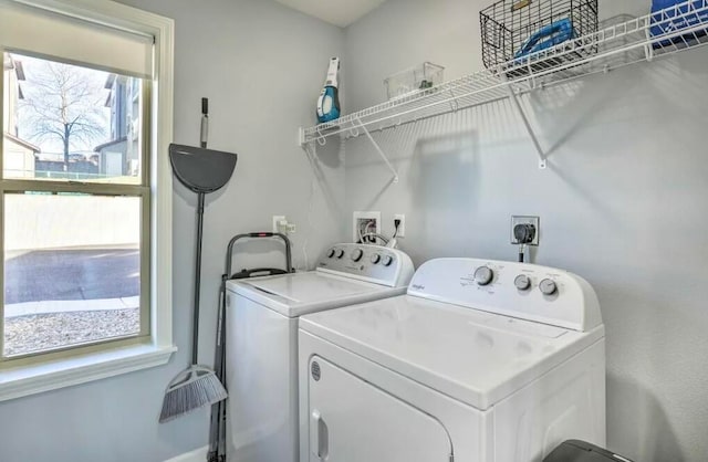 washroom featuring washer and clothes dryer